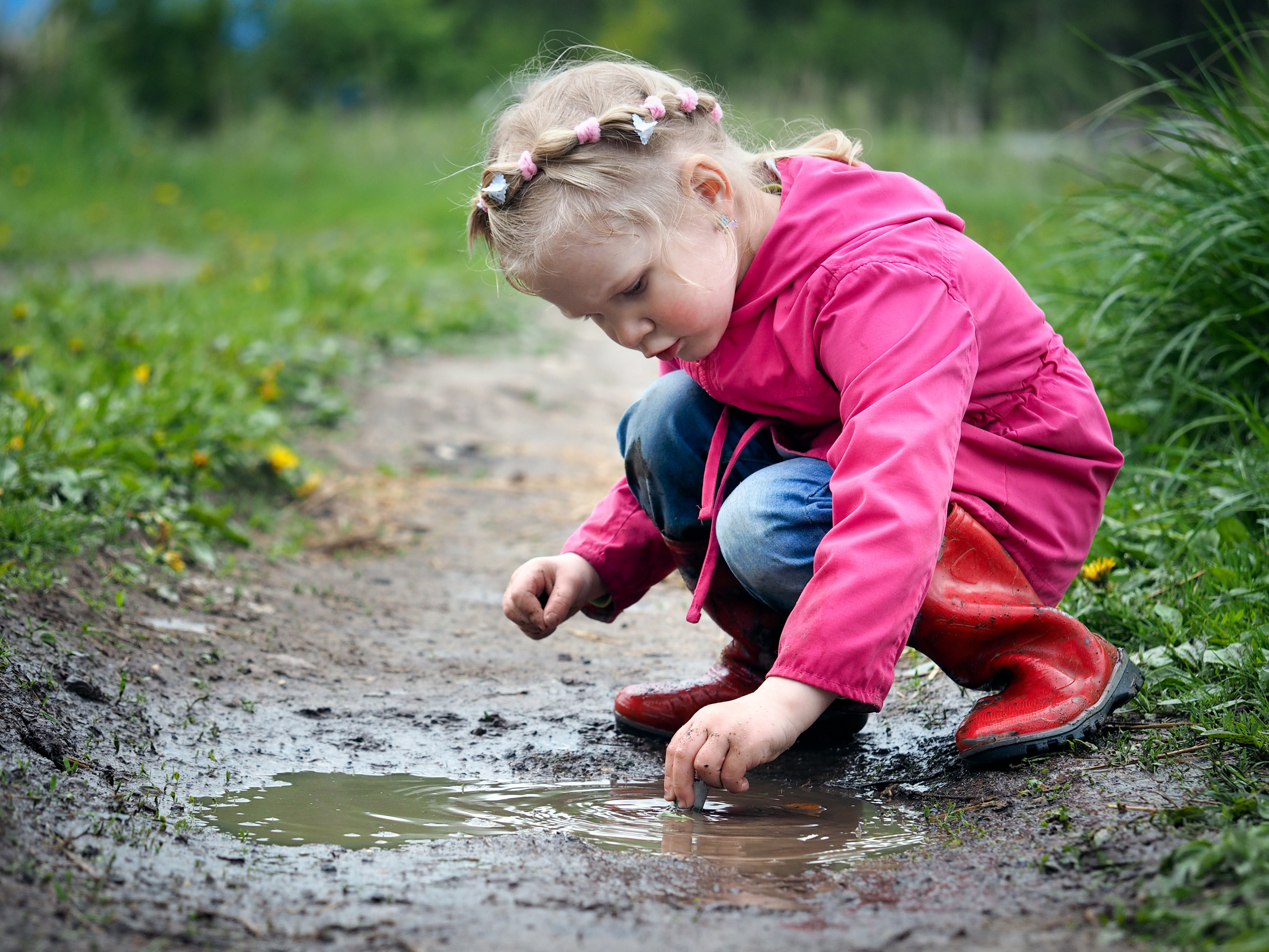 girl playing in mud