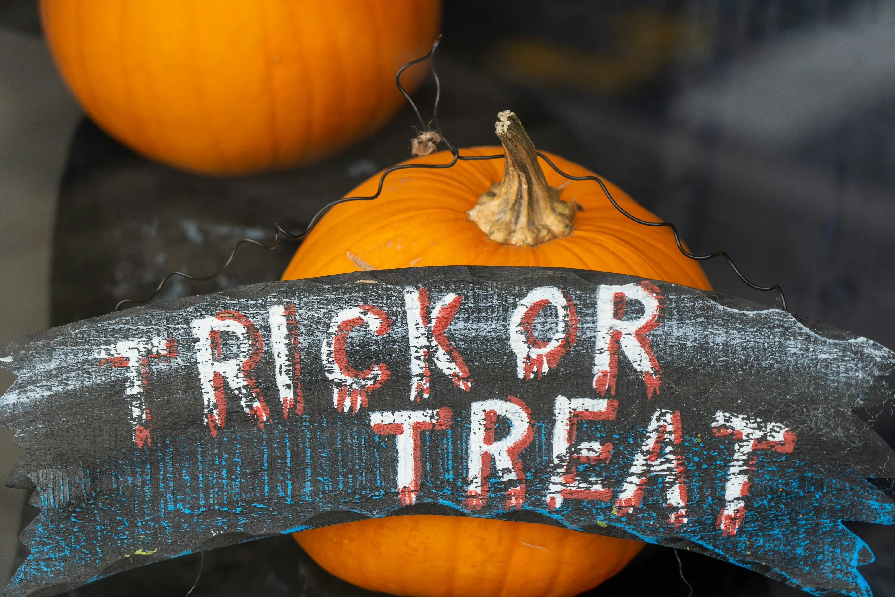 pumpkins with the words "trick or treat" in front of them