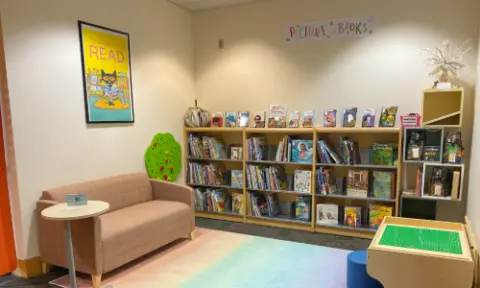 shows the valley library children's collection room with seating, books, and toys